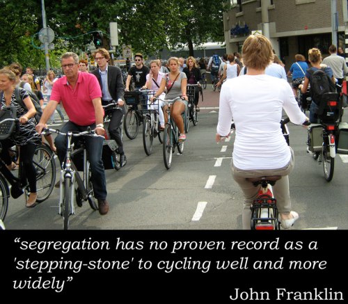 Photo of swarm of people on bikes using segregated bike path during rush-hour in Utrecht, with stupid John Franklin quote: "segregation has no proven record as a 'stepping-stone' to cycling well and more widely"