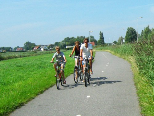 A family riding bikes in the Dutch countryside