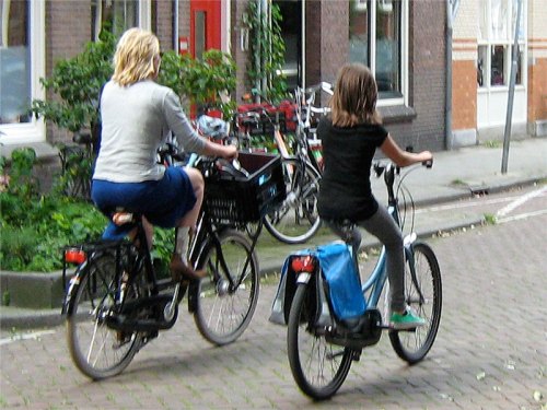 A mother and daughter cycling in the Netherlands.
