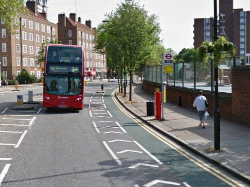 A bus about to pull into and therefore block the cycle lane, so that cars can pass freely
