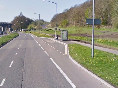 A photo of the same bus stop before the cycle bypass was installed. Buses crossed the cycle lane to pull in, and people riding bikes were expected to pass stopped buses on the outside.