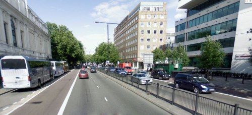 A photograph of Marylebone Road in London, which has six lanes for traffic and one parking lane.