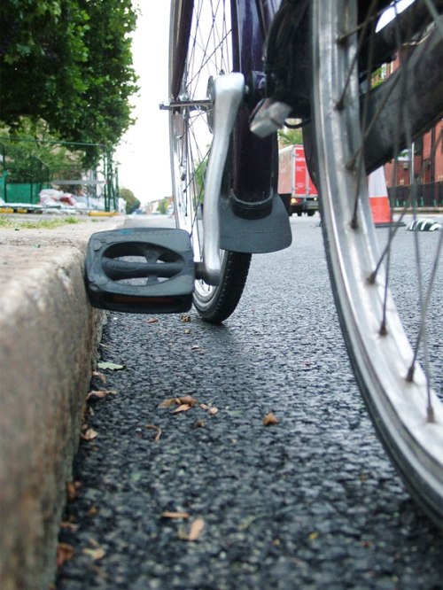 A photo of a bicycle pedal hitting the high kerb at Royal College Street.