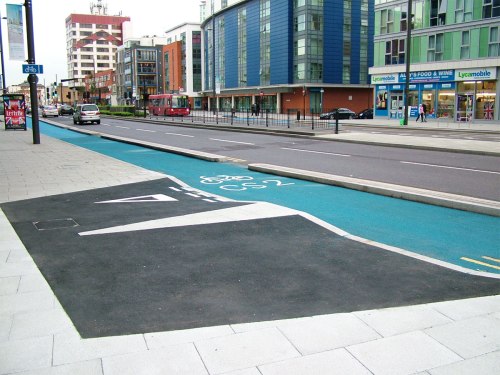 TfL's attempt at a Copenhagen-style junction results in a strange short-trouser-shaped tarmac area on the footpath