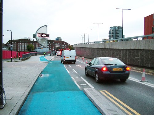 Cycle Superhighway 2 westbound, just before Bow roundabout. A dangerous side road treatment followed by a sharp bus stop bypass entry.