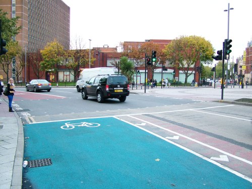 The eastern end of Cycle Superhighway 2 where users are expected to cycle onto a crossing where people are waiting.
