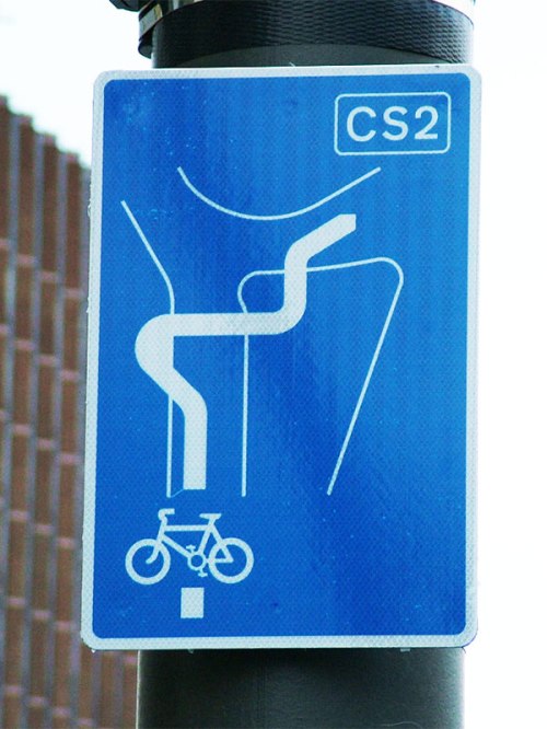 A sign on Cycle Superhighway 2 at Stratford in London, showing a wiggly dance which must be performed by those using the route