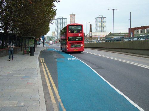 A photo of TfL's CS2 at Bow roundabout, with dangerous cycle lane and bus stop design.