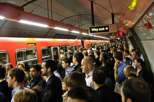 Hundreds of people cram onto an underground train
