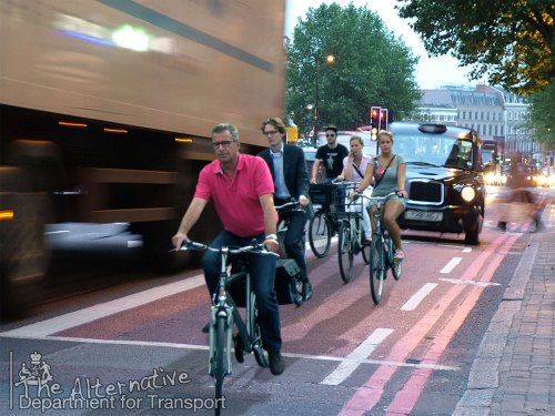 A group of commuters in Utrecht, cut out and pasted into a photo of Euston Road in London, complete with thundering HGV and black cab.