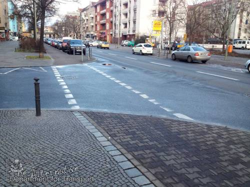 A junction in Berlin where bikes have priority, but there's only two broken white lines on the tarmac to suggest so.