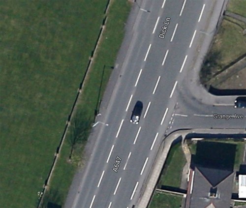 Satellite image of the junction of Grange Avenue and Dick Lane in Bradford. There's a wide grass verge and large grassed park over the road.