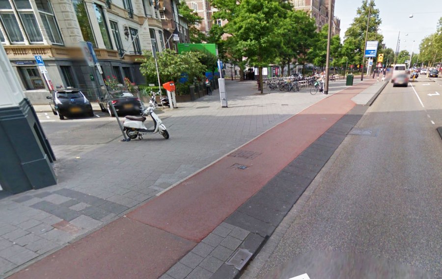 Junction in the Netherlands with continuous footway and cycleway across junction mouth, giving clear priority to people walking and people riding bikes