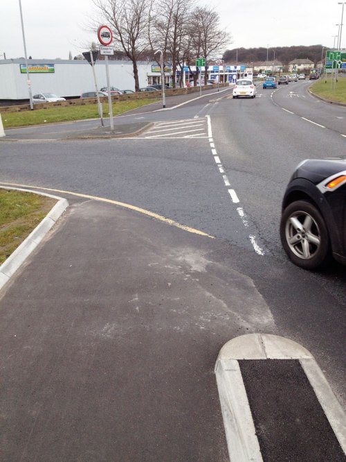 A car turns off the 40mph York Road directly into the path of the cycleway
